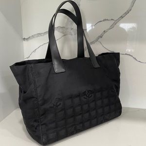 CHANEL Black Nylon CC Logo Travel Line Tote Bag with leather trim.